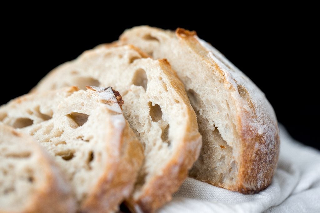 Small batch sourdough bread is airy and chewy with a crisp crust and a mild flavour. It takes less than 15 minutes of actual prep and requires no kneading. | aheadofthyme.com