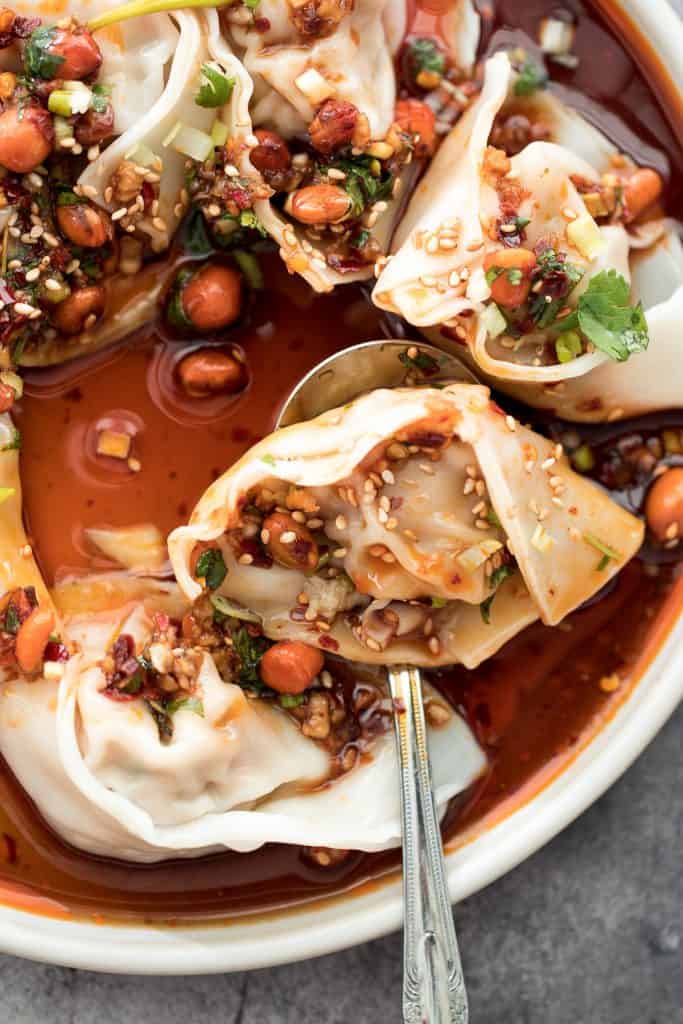 Easy spicy chili oil wontons, a signature Sichuan dish ready in just 10 minutes, hits every sense of your palate -- sour, spicy, sweet and nutty. | aheadofthyme.com