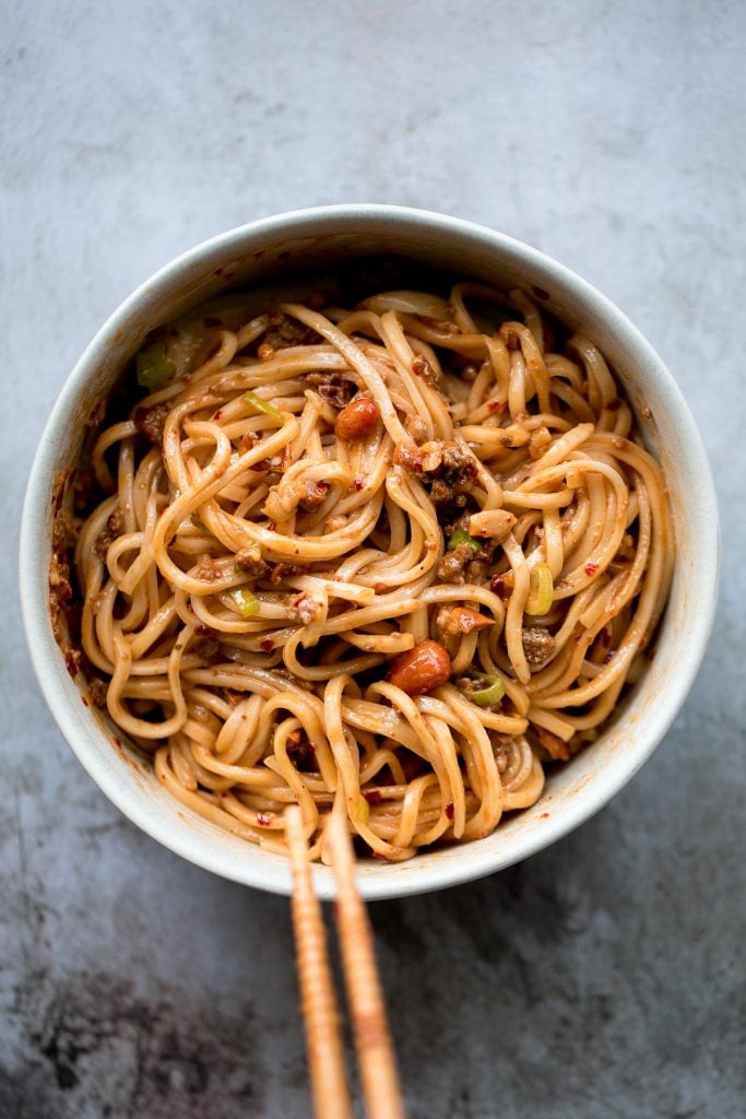 Toss thin wheat noodles in a spicy chili oil sauce and top with seasoned ground beef to make numbing, spicy Sichuan Dan Dan noodles in under 15 minutes. | aheadofthyme.com