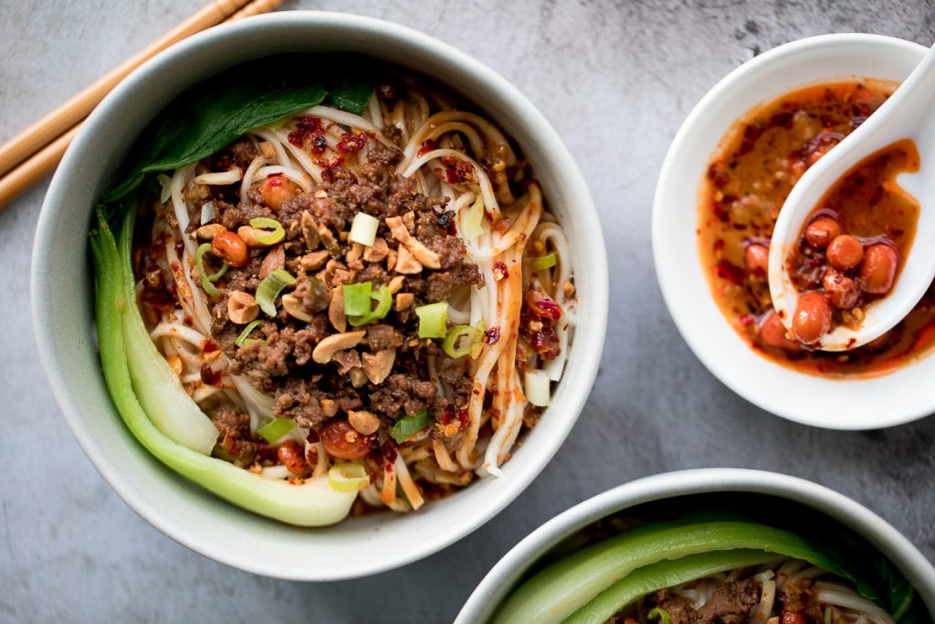 Toss thin wheat noodles in a spicy chili oil sauce and top with seasoned ground beef to make numbing, spicy Sichuan Dan Dan noodles in under 15 minutes. | aheadofthyme.com