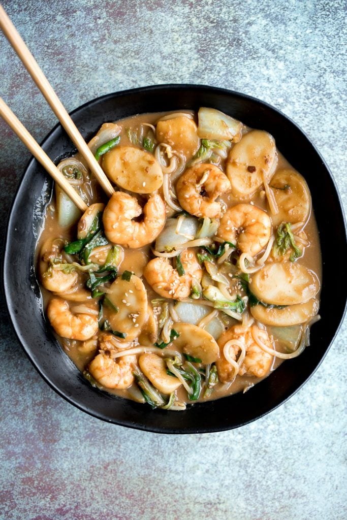 Better than takeout, stir-fried rice cakes with shrimp, bok choy, and bean sprouts in a delicious peanut butter sauce is a quick 10-minute one pan meal. | aheadofthyme.com