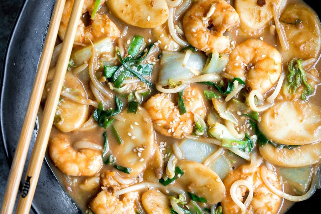 Better than takeout, stir-fried rice cakes with shrimp, bok choy, and bean sprouts in a delicious peanut butter sauce is a quick 10-minute one pan meal. | aheadofthyme.com