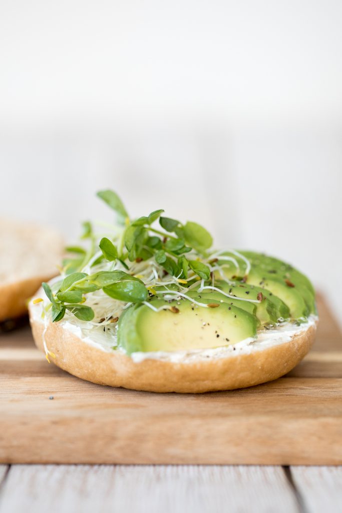This simple and fully customizable avocado bagel with cream cheese is loaded with cream cheese,  avocado, and microgreens. Such an easy breakfast or lunch! | aheadofthyme.com