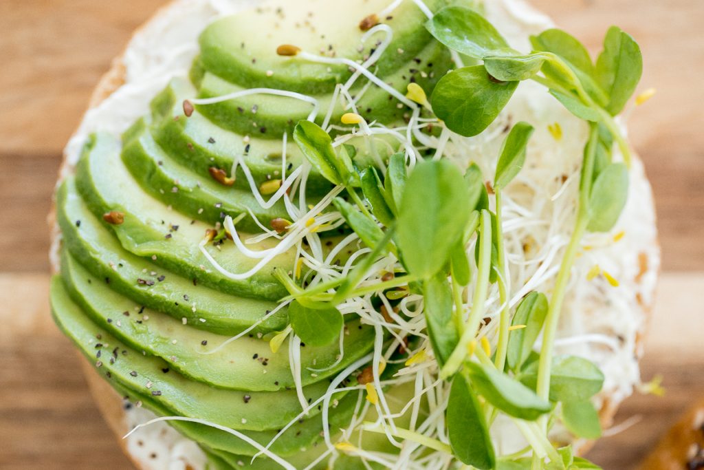 This simple and fully customizable avocado bagel with cream cheese is loaded with cream cheese, avocado, and microgreens. Such an easy breakfast or lunch! | aheadofthyme.com