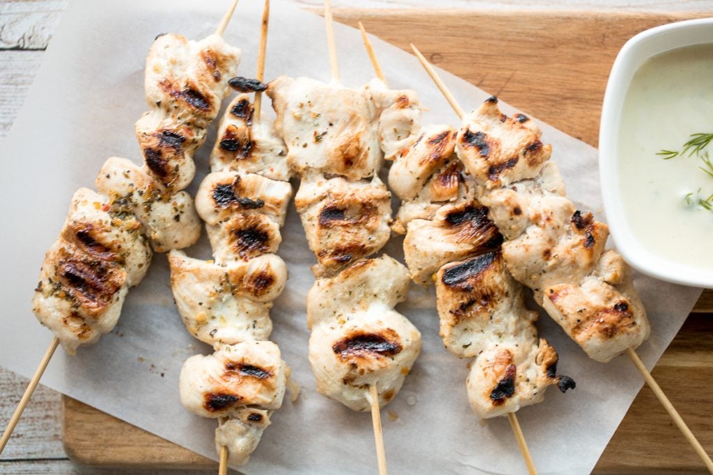 Easy Greek chicken souvlaki skewers marinated in garlic, fresh herbs, lemon and bay leaves for that classic Mediterranean flavour. Grill in under 15 minutes. | aheadofthyme.com