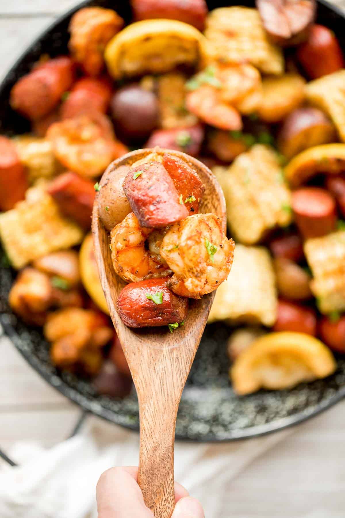 Easy Grilled Shrimp Boil is the ultimate summer meal: loaded with prawns, corn, and sausage, tossed in buttery garlic and herbs. Ready in 30 minutes! | aheadofthyme.com