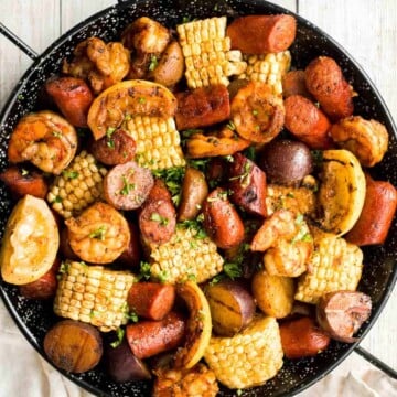 Easy Grilled Shrimp Boil is the ultimate summer meal: loaded with prawns, corn, and sausage, tossed in buttery garlic and herbs. Ready in 30 minutes! | aheadofthyme.com