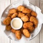 Easy homemade chicken nuggets with chicken breast are golden and crisp on the outside and juicy and tender inside. They're freezer-friendly so make extra. | aheadofthyme.com