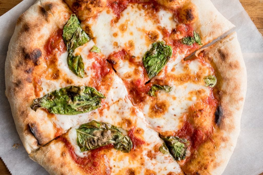 Quick and easy skillet Neapolitan margherita pizza has an iconic thin and soft crust with a perfectly crisp exterior, and simple and fresh toppings. | aheadofthyme.com