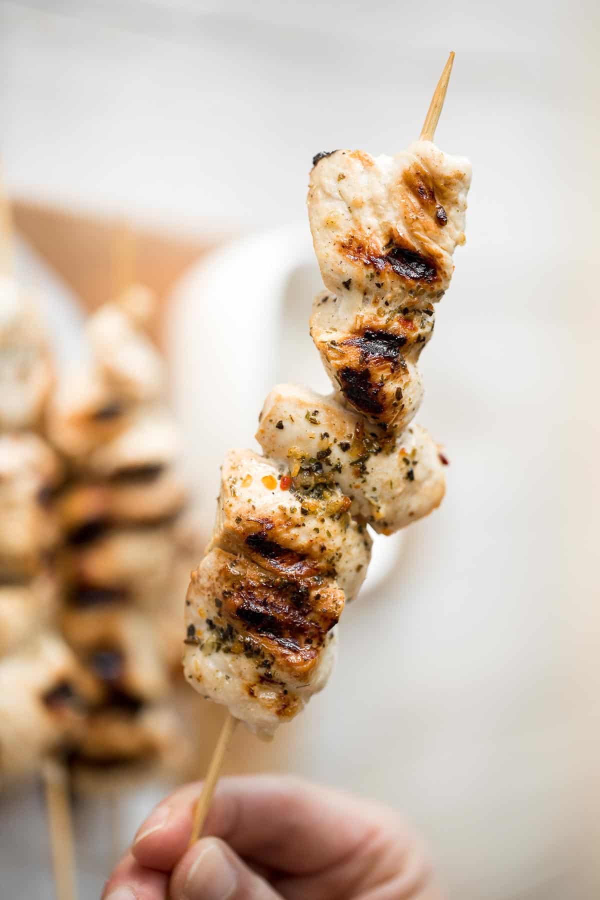 Easy Greek Chicken Souvlaki Skewers are marinated in garlic, herbs, and lemon for that classic Mediterranean flavour. Grill in under 15 minutes! | aheadofthyme.com