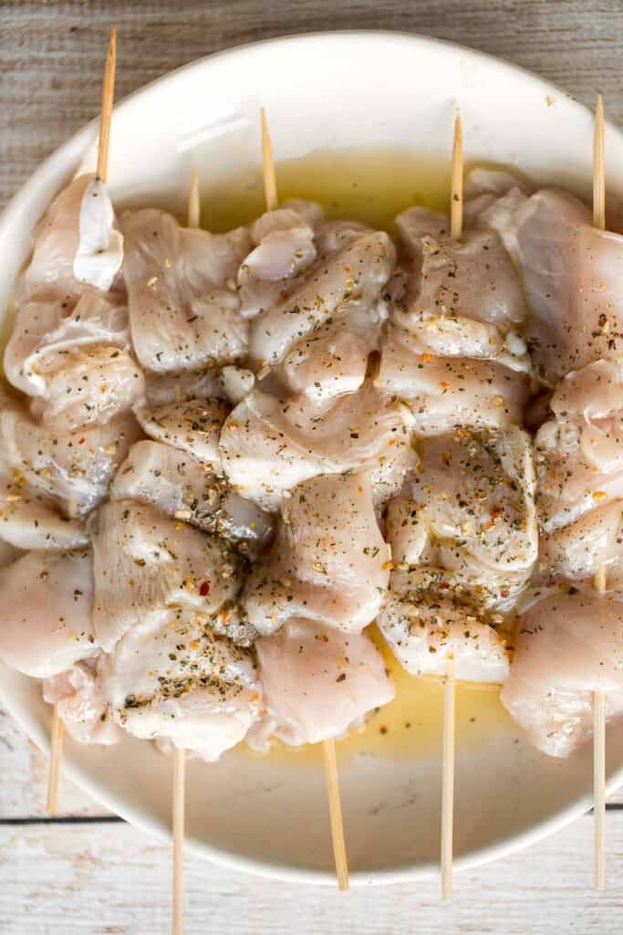 Easy Greek Chicken Souvlaki Skewers are marinated in garlic, herbs, and lemon for that classic Mediterranean flavour. Grill in under 15 minutes! | aheadofthyme.com