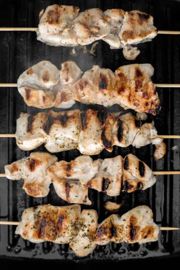 Easy Greek Chicken Souvlaki Skewers are marinated in garlic, herbs, and lemon for that classic Mediterranean flavour. Grill in under 15 minutes! | aheadofthyme.com