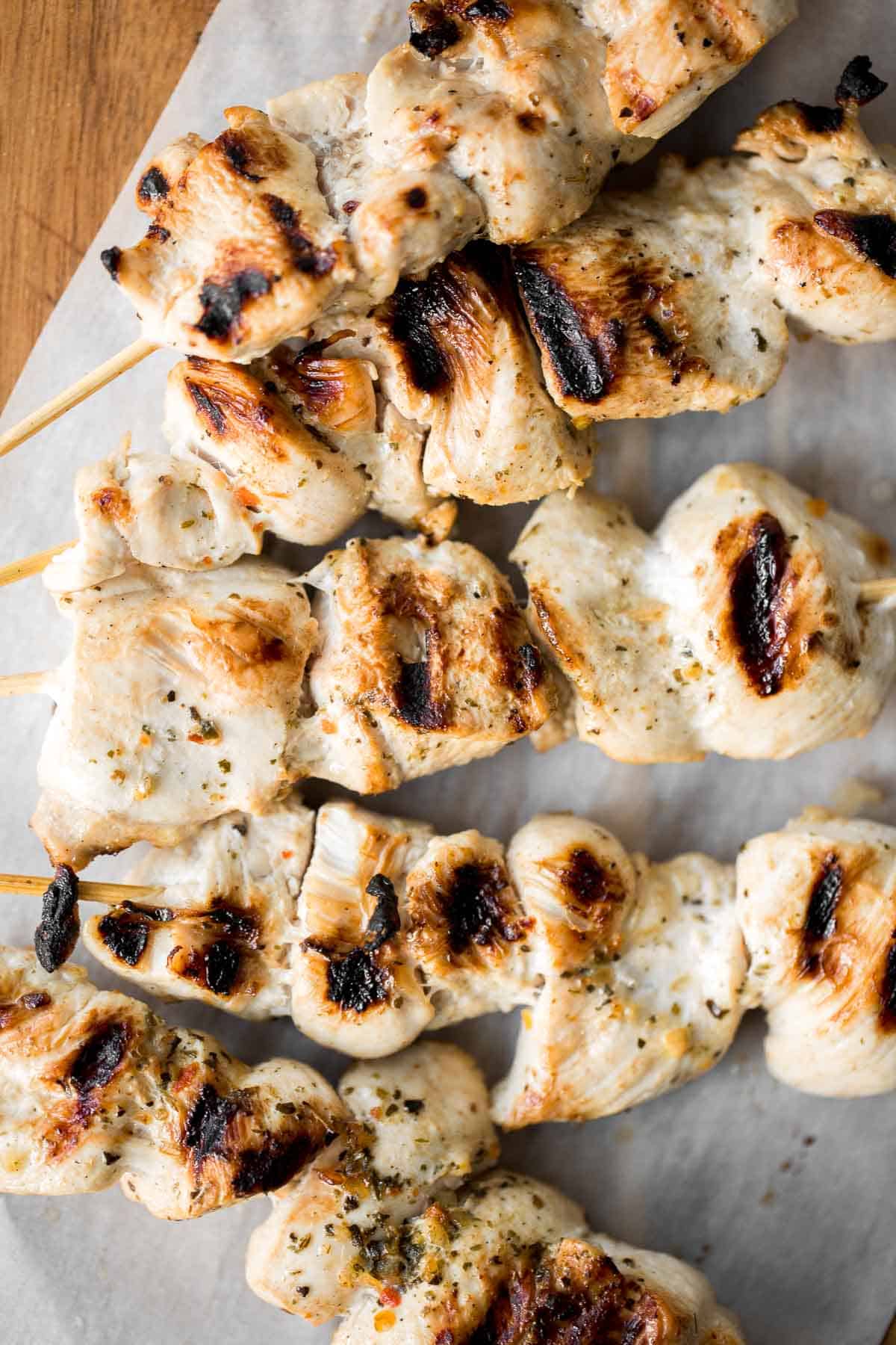 Easy Greek Chicken Souvlaki Skewers are marinated in garlic, herbs, and lemon for that classic Mediterranean flavour. Grill in under 15 minutes! | aheadofthyme.com