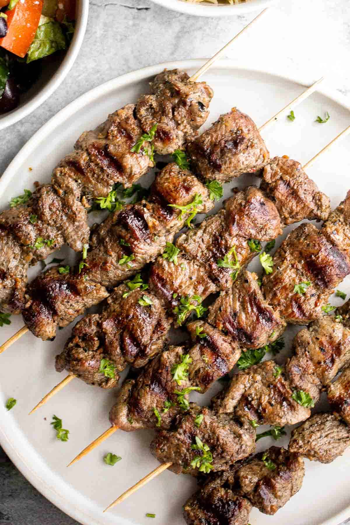 Grilled Greek Lamb Souvlaki Skewers with a simple Mediterranean marinade are juicy, bold, and easy to grill. Serve with pita, salad, rice, or tzatziki. | aheadofthyme.com