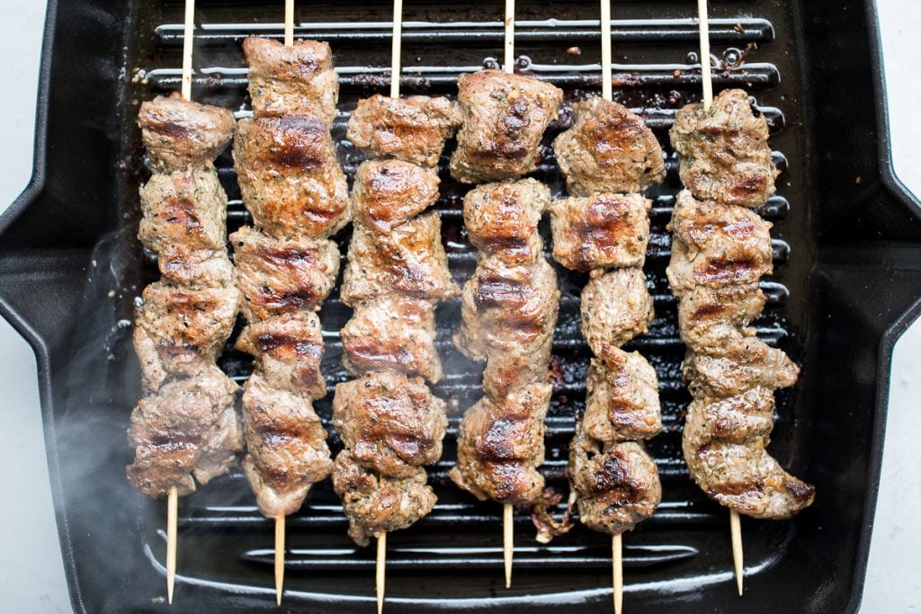 Quick and easy, grilled Greek lamb souvlaki skewers are marinated in a simple Mediterranean marinade for just 30 minutes. Serve with some tzatziki sauce. | aheadofthyme.com