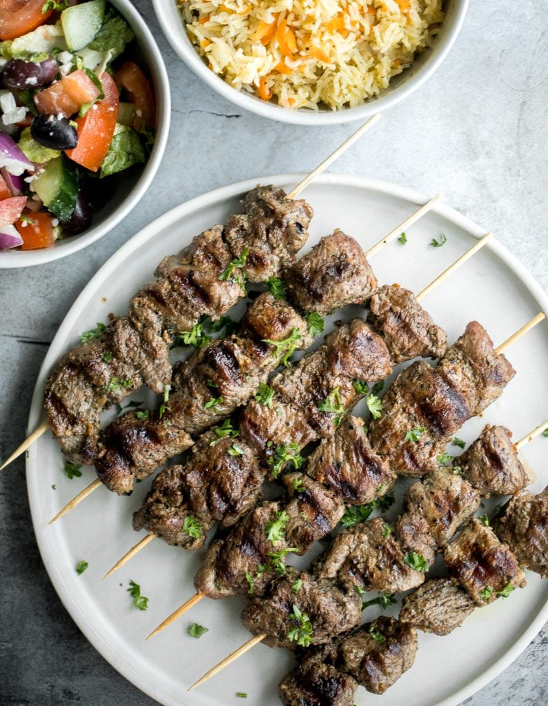 Quick and easy, grilled Greek lamb souvlaki skewers are marinated in a simple Mediterranean marinade for just 30 minutes. Serve with some tzatziki sauce. | aheadofthyme.com