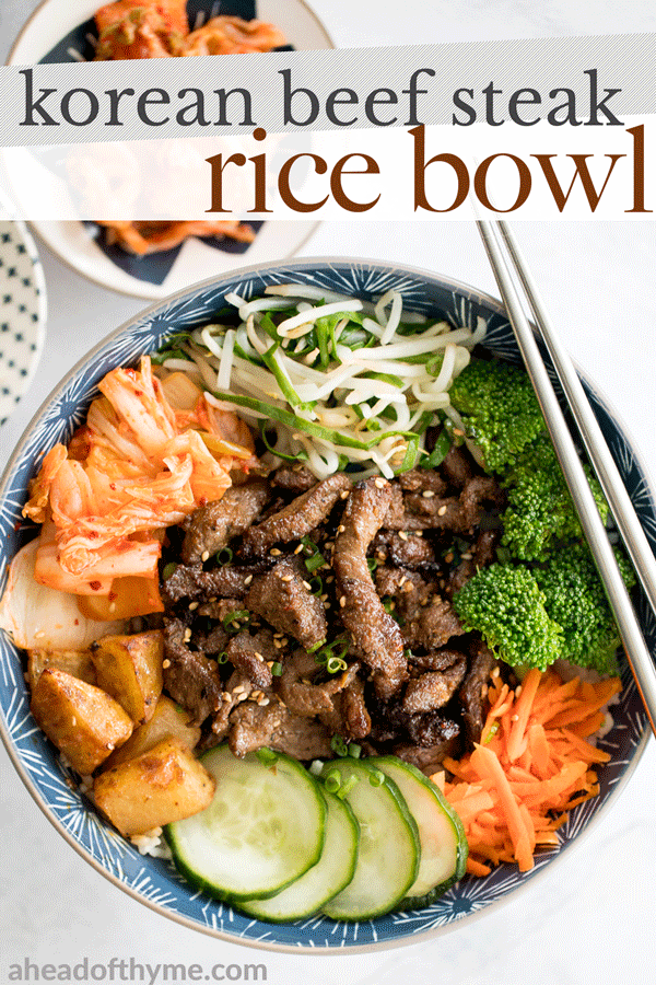 Korean beef steak rice bowl is loaded with tender and juicy strips of beef, marinated vegetable sides (banchan), and kimchi. Make it in under 30 minutes! | aheadofthyme.com