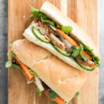 This easy-to-make, light and crunchy Vietnamese lemongrass chicken banh mi sandwich is packed with tender chicken, pickled vegetables and fresh herbs. | aheadofthyme.com
