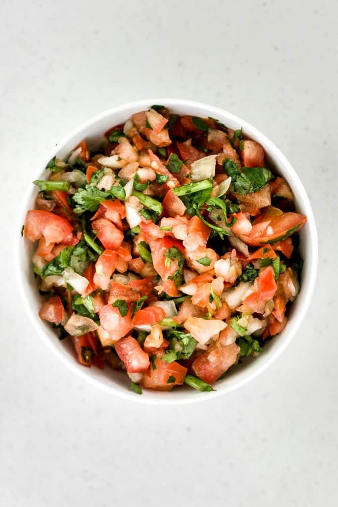 Easy 5-minute pico de gallo chunky salsa is packed with fresh tomatoes, onion, cilantro, and lime juice (and optional jalapeños for a spicy kick). | aheadofthyme.com