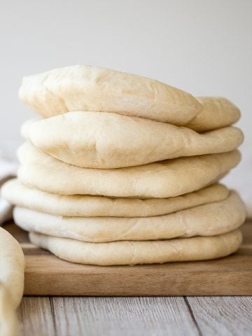 Nothing compares to freshly baked, quick and easy homemade pita bread. It's soft and puffy, with a perfect pocket. It takes just 15 minutes of actual prep. | aheadofthyme.com