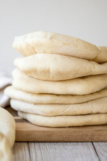 Nothing compares to freshly baked, quick and easy homemade pita bread. It's soft and puffy, with a perfect pocket. It takes just 15 minutes of actual prep. | aheadofthyme.com