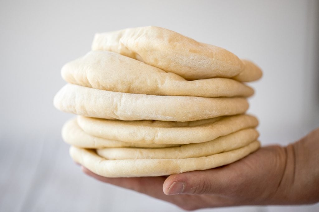 Nothing compares to freshly baked, quick and easy homemade pita bread. It's soft and puffy, with a perfect pocket. It takes just 15 minutes of actual prep. | aheadofthyme.com