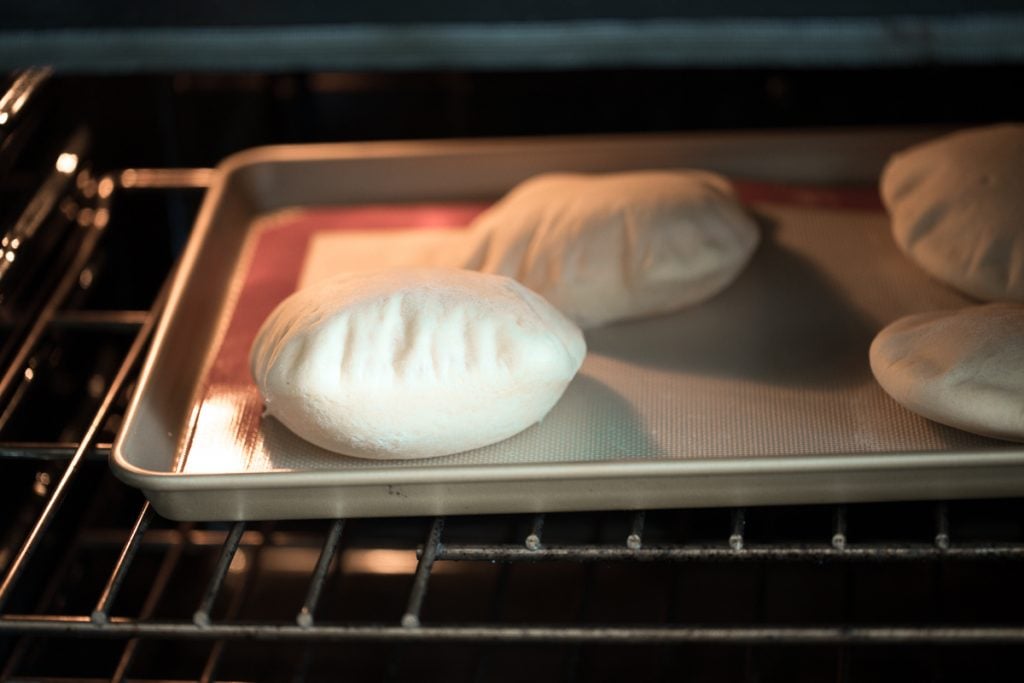 Nothing compares to freshly baked, quick and easy homemade pita bread. It's soft and puffy, with a perfect pocket. It takes just 15 minutes of actual prep. | aheadofthyme.com