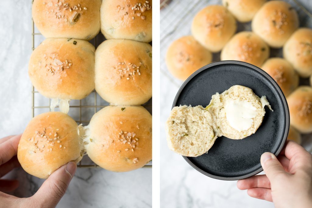 Soft and fluffy, quick dinner bread rolls are loaded with green onions and topped with flaked sea salt and sesame seeds. Ready in just 1.5 hours. | aheadofthyme.com