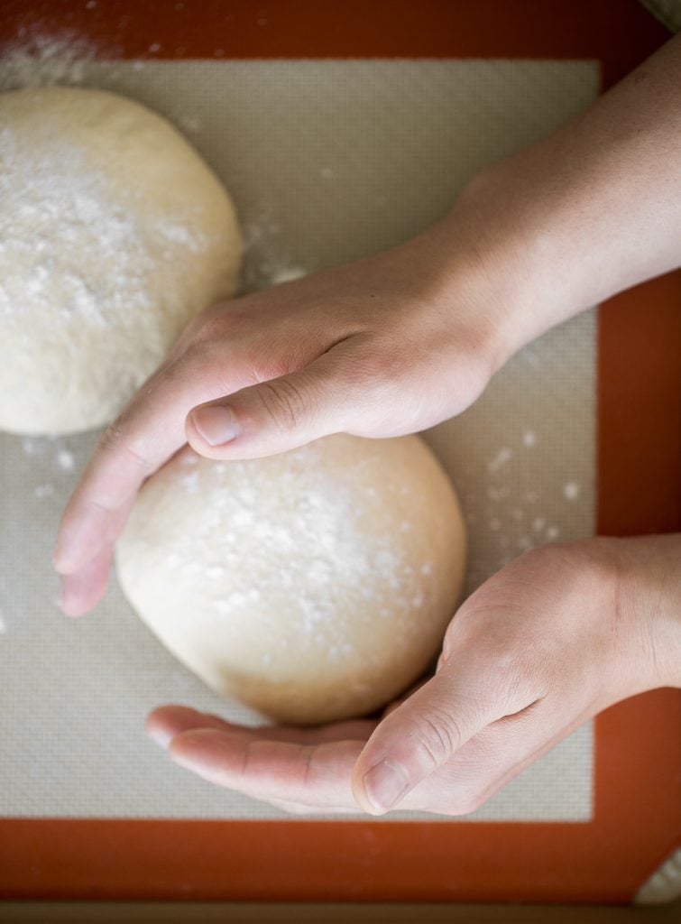 Use excess sourdough starter discard to make the best, easiest homemade small batch sourdough pizza dough to make an airy and chewy sourdough pizza crust. | aheadofthyme.com