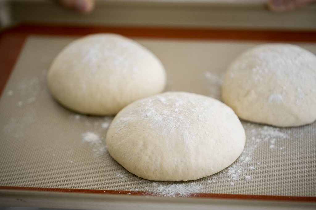 Use excess sourdough starter discard to make the best, easiest homemade small batch sourdough pizza dough to make an airy and chewy sourdough pizza crust. | aheadofthyme.com