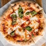 Use excess sourdough starter discard to make the best, easiest homemade small batch sourdough pizza dough to make an airy and chewy sourdough pizza crust. | aheadofthyme.com