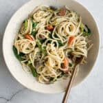 10-minute creamy spaghetti alfredo with spinach, mushrooms and tomatoes is tossed in a smooth buttery and garlicky alfredo sauce with fresh parsley. | aheadofthyme.com