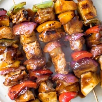 Juicy and tender Teriyaki Chicken Skewers with pineapple, bell peppers and red onions are sticky, sweet, savoury, and tangy. So flavourful and delicious. | aheadofthyme.com