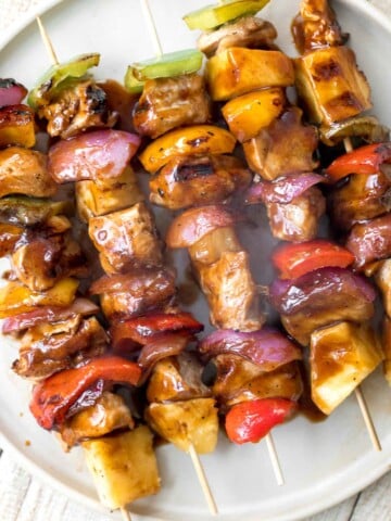 Juicy and tender Teriyaki Chicken Skewers with pineapple, bell peppers and red onions are sticky, sweet, savoury, and tangy. So flavourful and delicious. | aheadofthyme.com