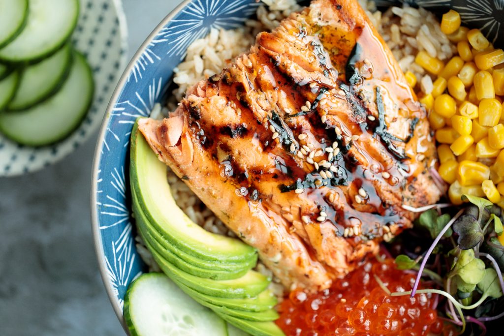 Easy to make, light and fresh teriyaki grilled salmon rice bowl is topped with vegetables, seaweed and salmon roe, with homemade teriyaki sauce on top. | aheadofthyme.com