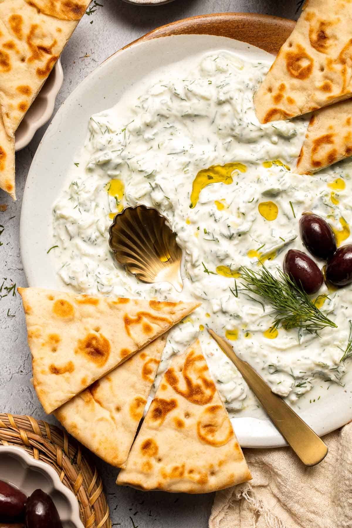 Easy Tzatziki Sauce is a cool, creamy Greek dip made with thick Greek yogurt, crisp cucumber, zesty lemon juice, and fresh dill. Quick and easy too! | aheadofthyme.com