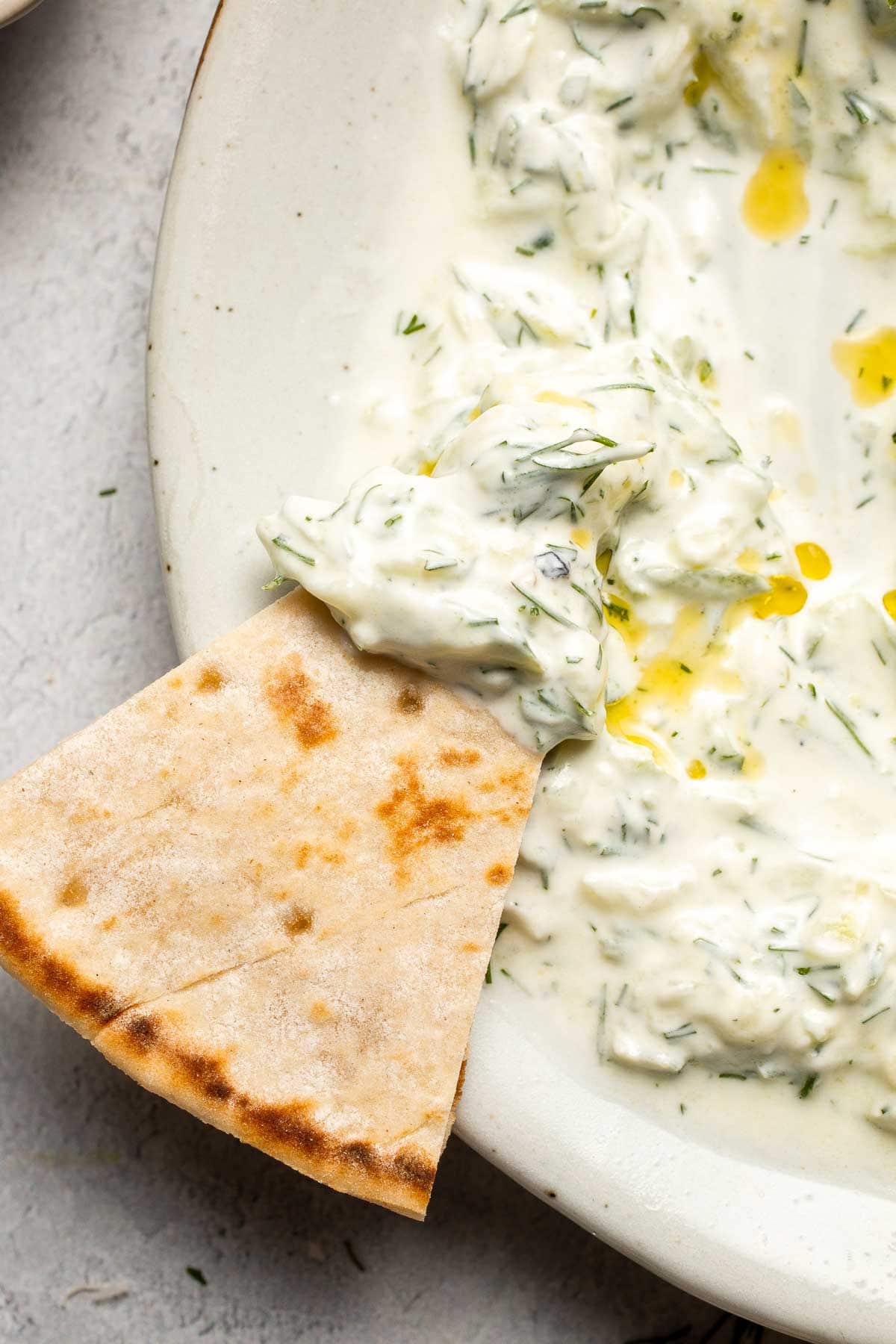 Easy Tzatziki Sauce is a cool, creamy Greek dip made with thick Greek yogurt, crisp cucumber, zesty lemon juice, and fresh dill. Quick and easy too! | aheadofthyme.com