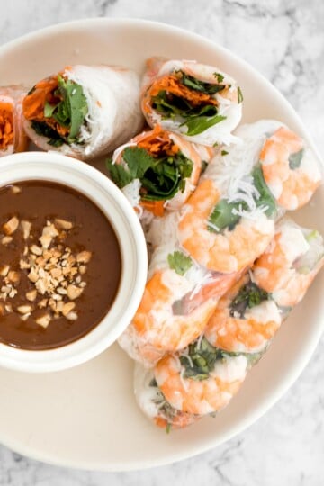Fresh, light, and healthy Vietnamese Salad Rolls are filled with shrimp, vegetables, and herbs, and served with a delicious homemade peanut dipping sauce. | aheadofthyme.com