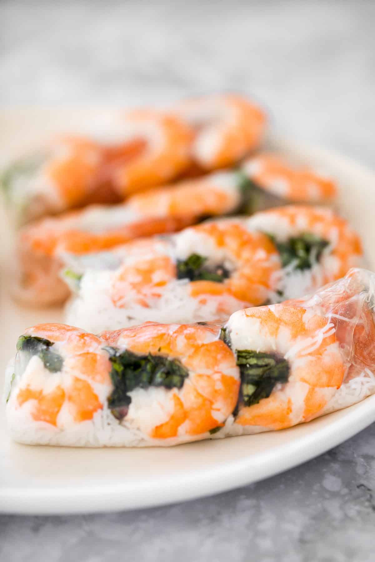Fresh, light, and healthy Vietnamese Salad Rolls are filled with shrimp, vegetables, and herbs, and served with a delicious homemade peanut dipping sauce. | aheadofthyme.com