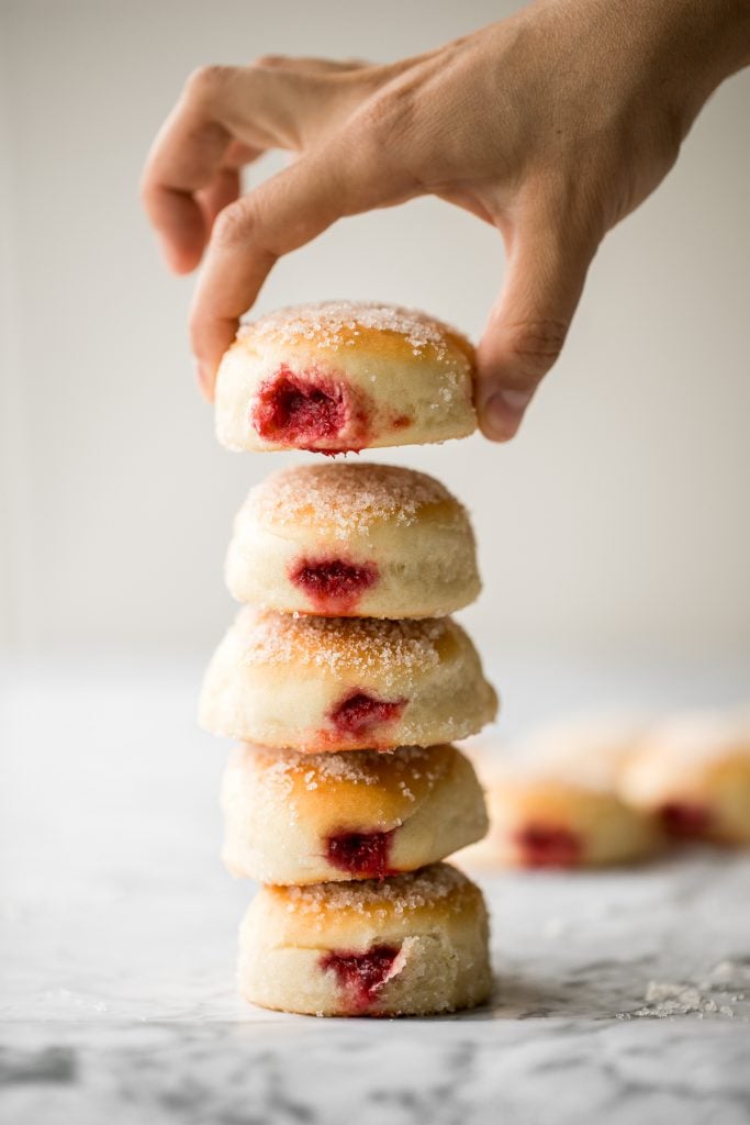 These melt-in-your-mouth, homemade baked jelly donuts, coated in sugar and filled with sweet strawberry jam, are so soft, fluffy, spongy and airy. | aheadofthyme.com