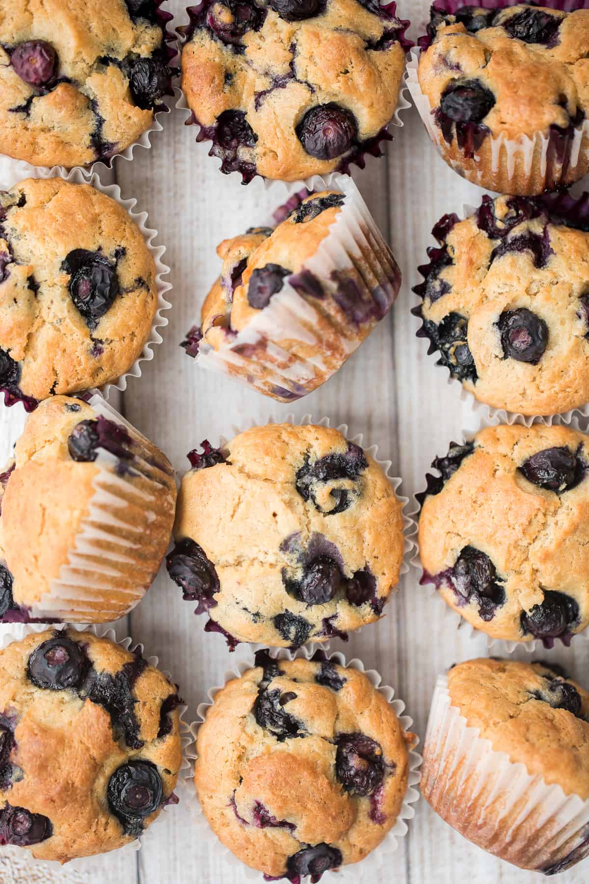 Blueberry yogurt muffins are buttery, moist, soft, and cakey and bursting with blueberries in every single bite. They are super quick and easy to make. | aheadofthyme.com