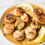 Garlicky, buttery, and perfectly seared scallops take less than 10 minutes to prep and cook. It's the easiest fancy, restaurant-grade meal to make at home. | aheadofthyme.com