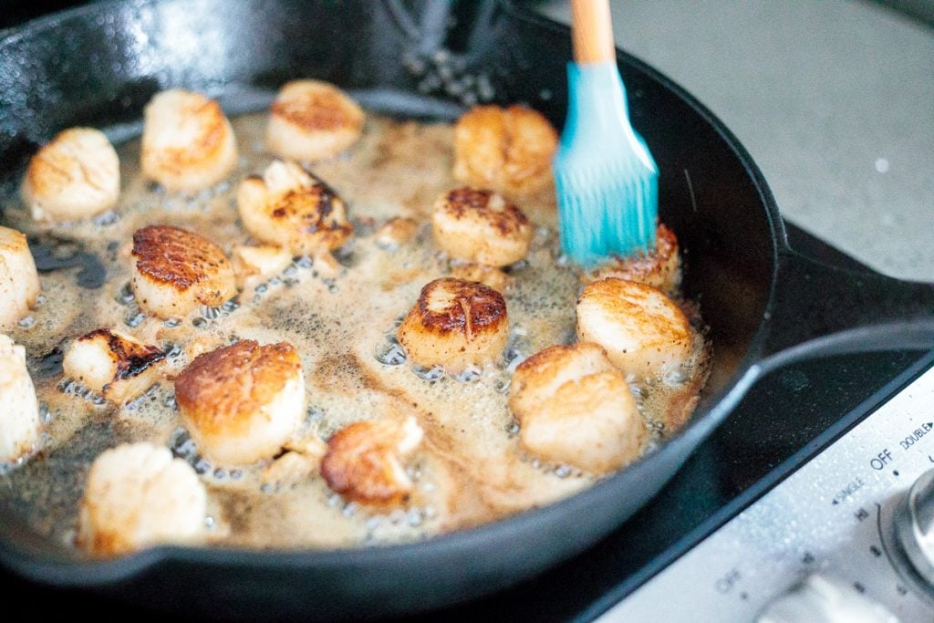 Garlicky, buttery, and perfectly seared scallops take less than 10 minutes to prep and cook. It's the easiest fancy, restaurant-grade meal to make at home. | aheadofthyme.com