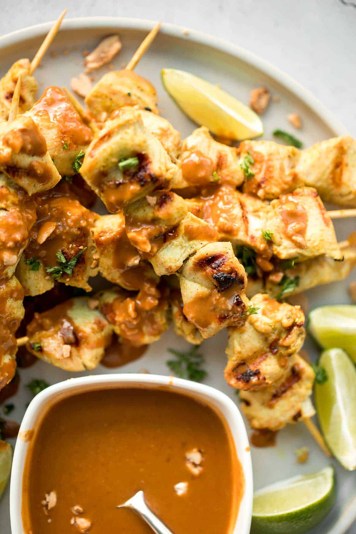 Better than takeout, these Chicken Satay Skewers with a peanut sauce are juicy, tender, and easy to make at home. They're savoury, sweet, tangy, and nutty. | aheadofthyme.com