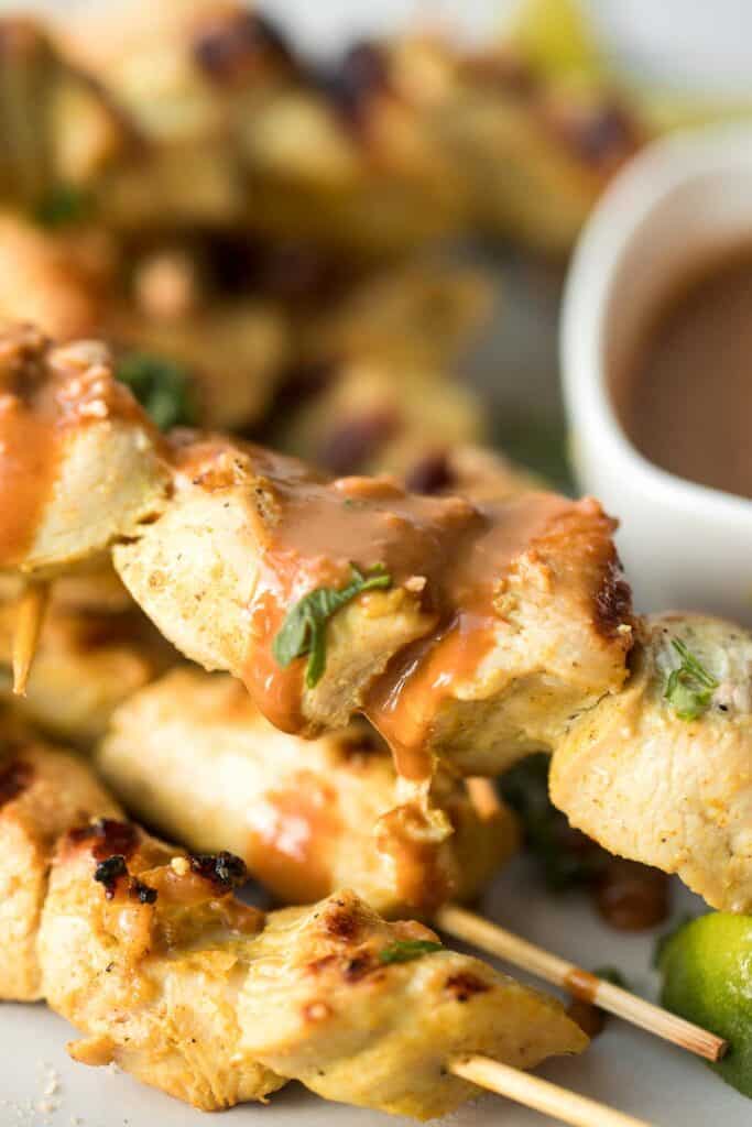 Better than takeout, these Chicken Satay Skewers with a peanut sauce are juicy, tender, and easy to make at home. They're savoury, sweet, tangy, and nutty. | aheadofthyme.com