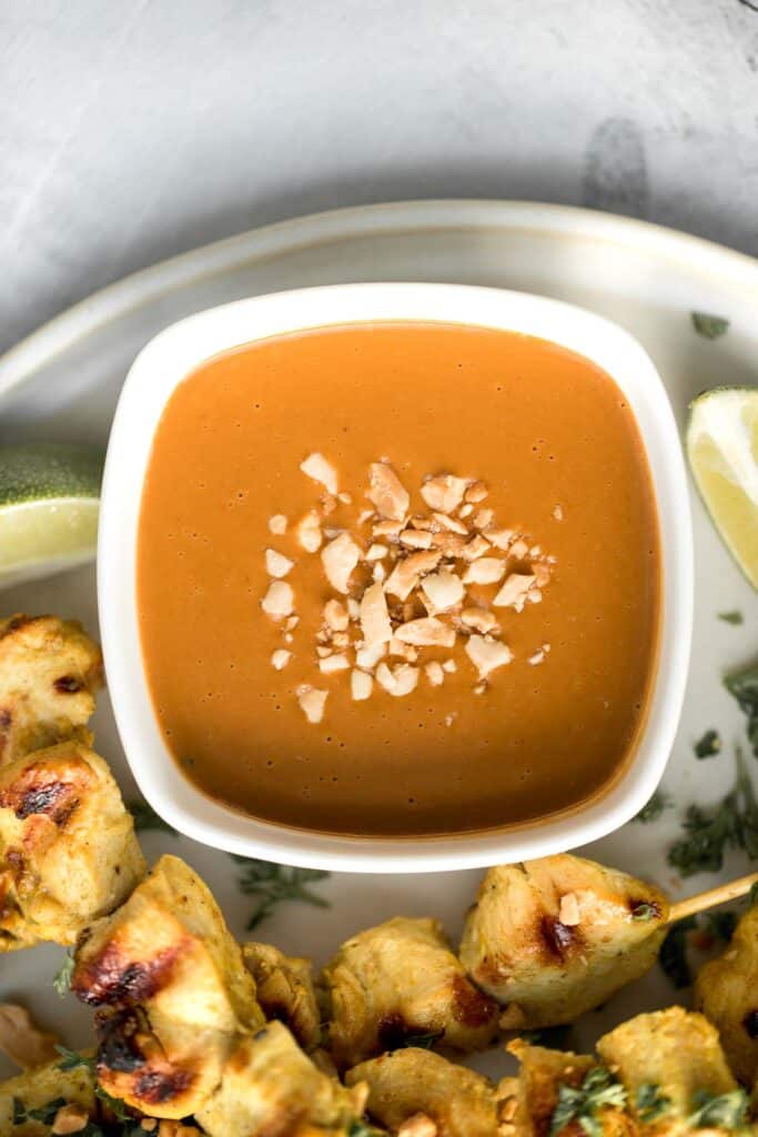 Better than takeout, these Chicken Satay Skewers with a peanut sauce are juicy, tender, and easy to make at home. They're savoury, sweet, tangy, and nutty. | aheadofthyme.com