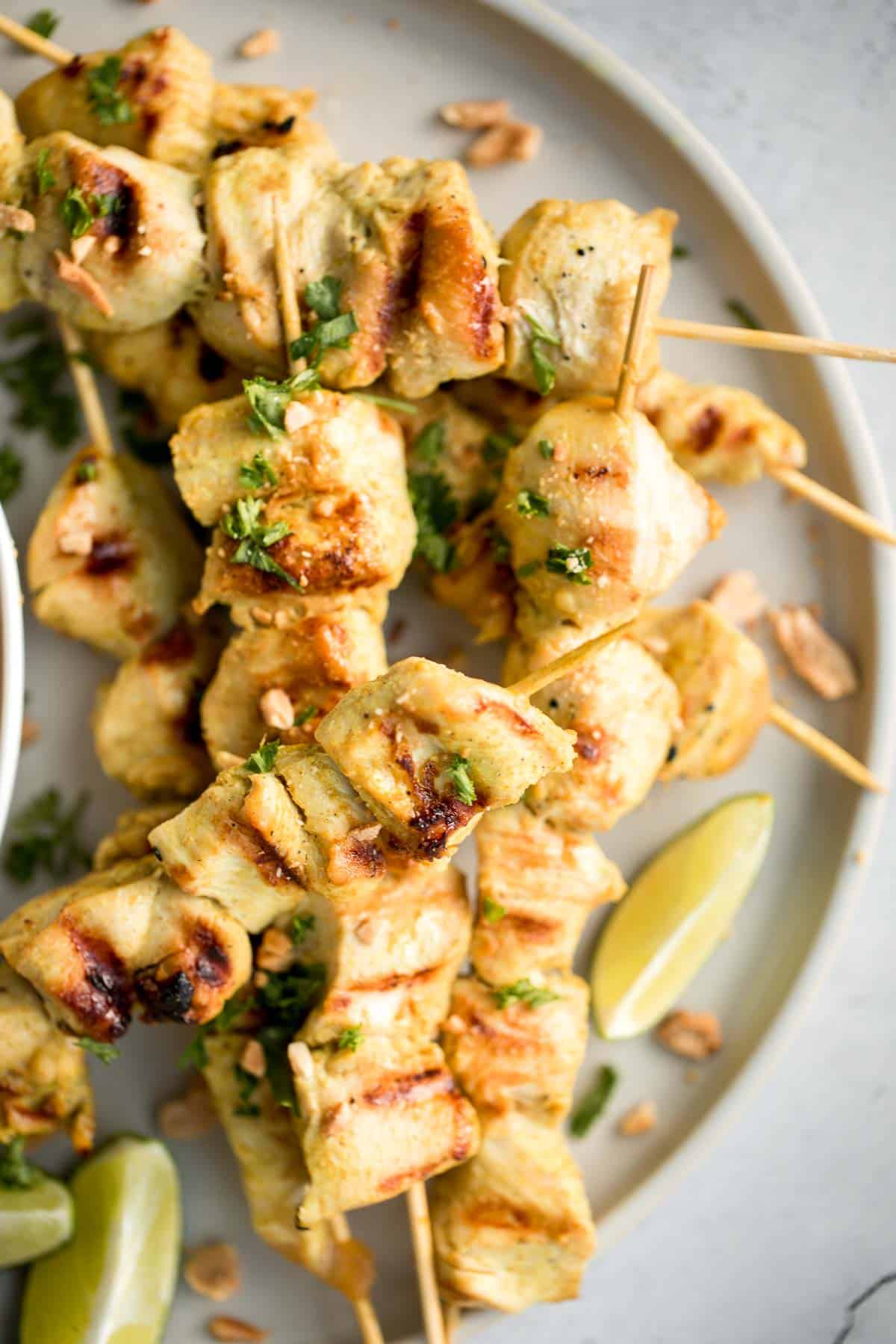 Better than takeout, these Chicken Satay Skewers with a peanut sauce are juicy, tender, and easy to make at home. They're savoury, sweet, tangy, and nutty. | aheadofthyme.com