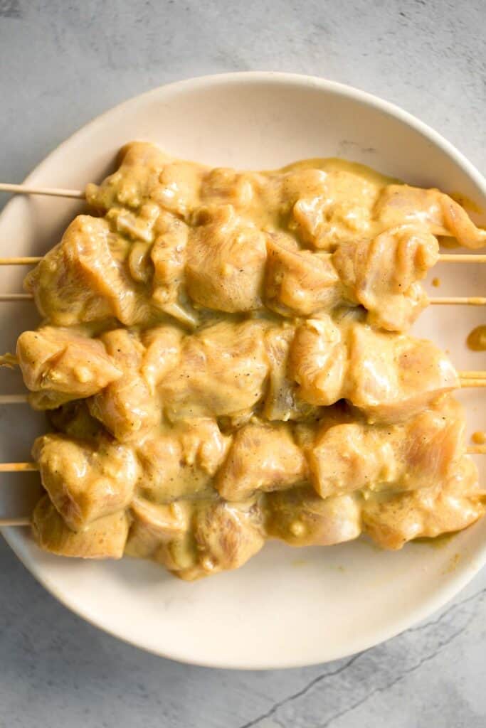 Better than takeout, these Chicken Satay Skewers with a peanut sauce are juicy, tender, and easy to make at home. They're savoury, sweet, tangy, and nutty. | aheadofthyme.com