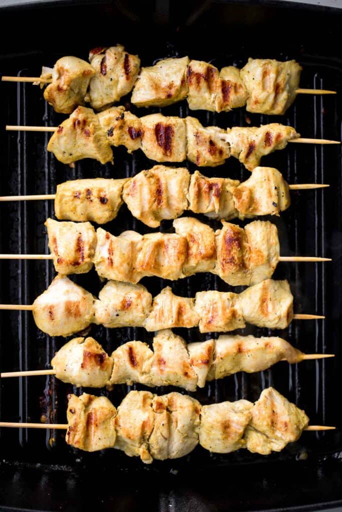 Better than takeout, these Chicken Satay Skewers with a peanut sauce are juicy, tender, and easy to make at home. They're savoury, sweet, tangy, and nutty. | aheadofthyme.com