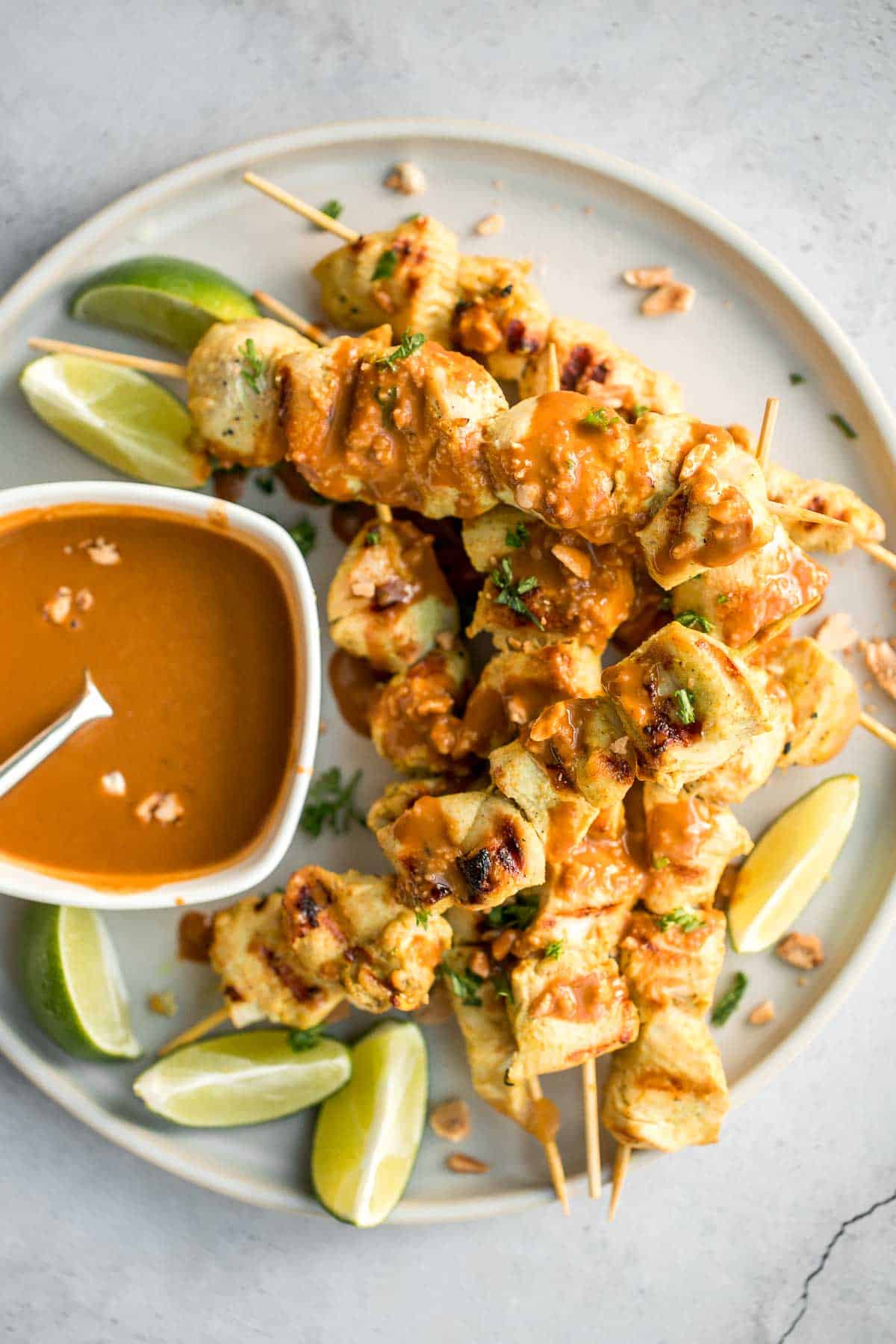 Better than takeout, these Chicken Satay Skewers with a peanut sauce are juicy, tender, and easy to make at home. They're savoury, sweet, tangy, and nutty. | aheadofthyme.com